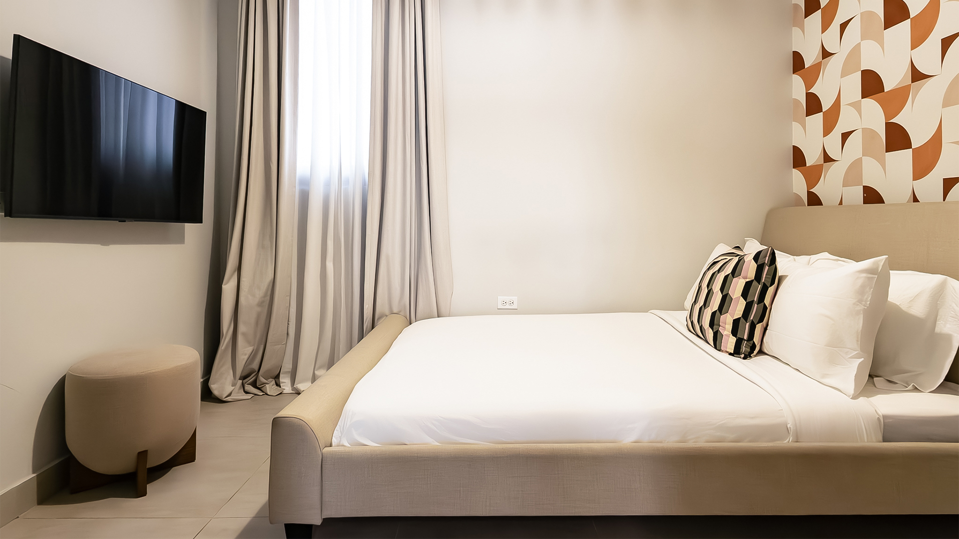 a bed with a pillow in a room