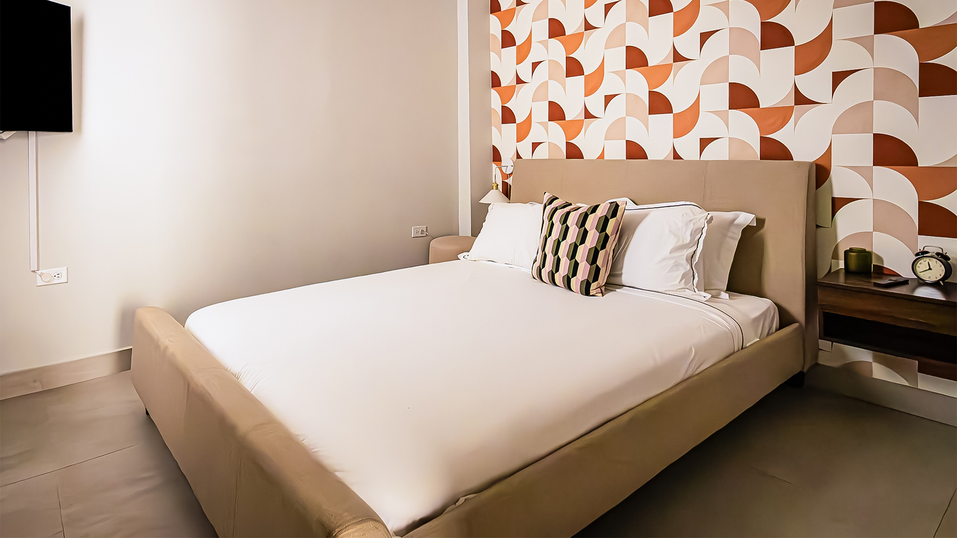 a bed with pillows in a room