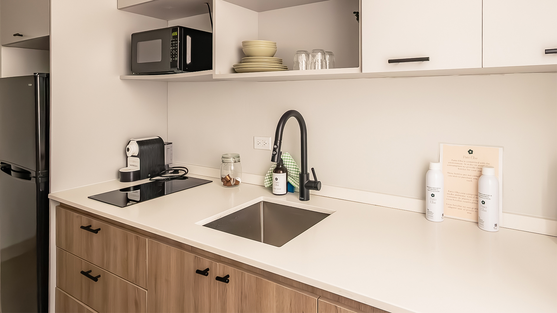 a kitchen with a sink and microwave