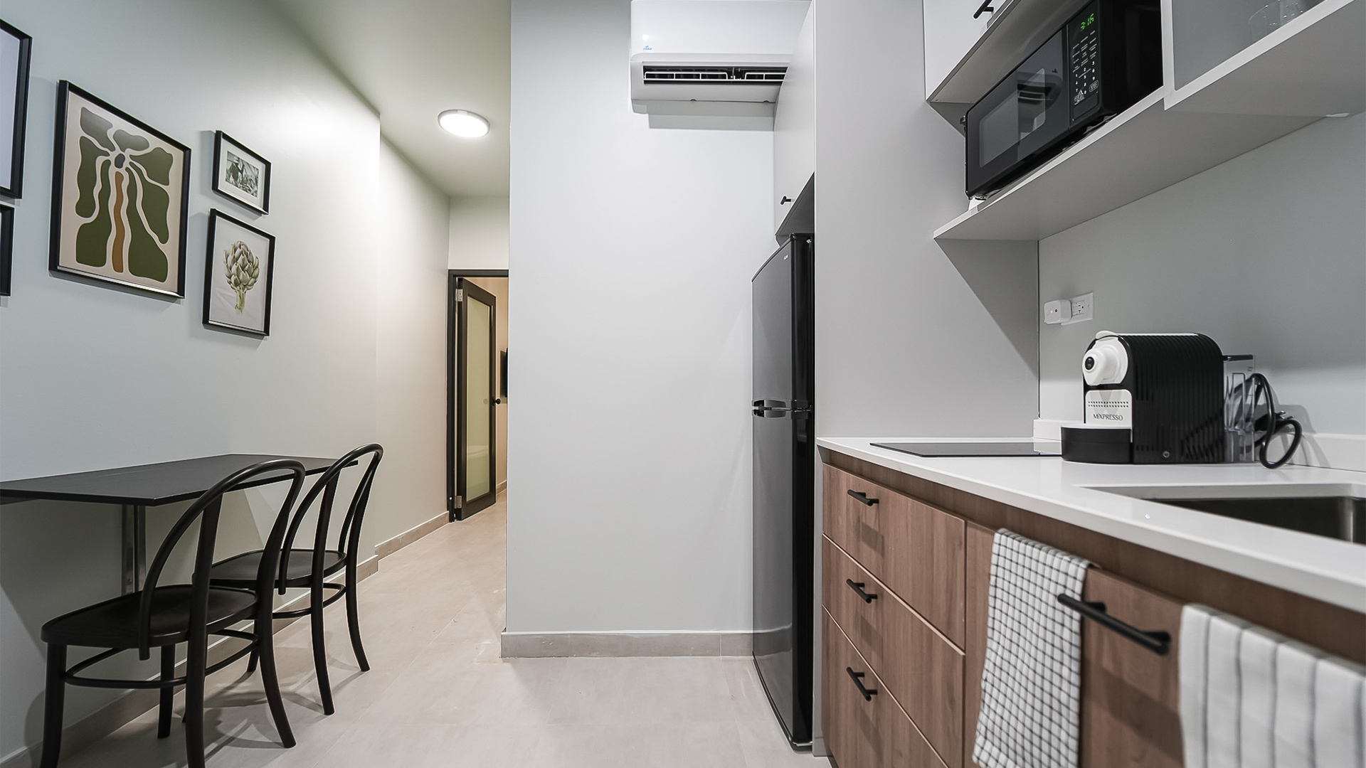 a kitchen with a microwave oven and a table
