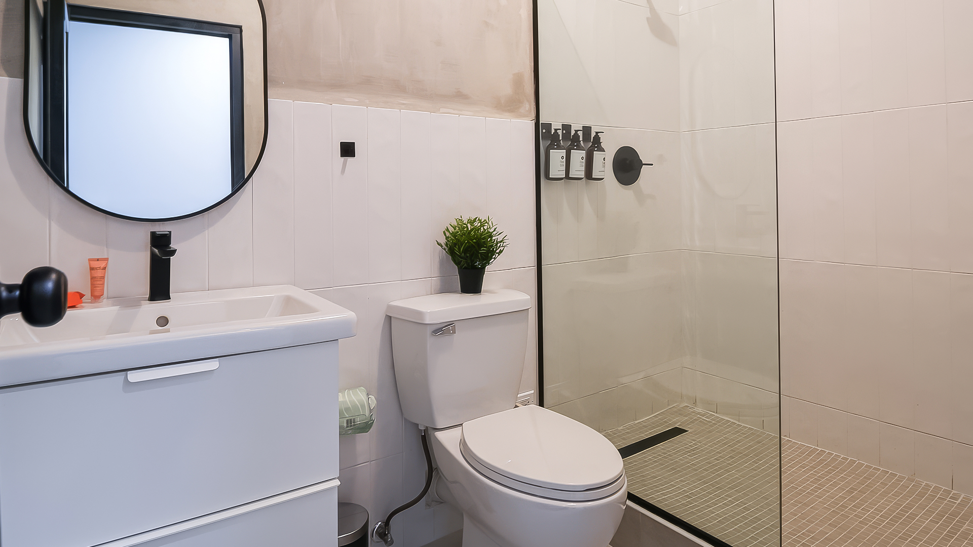 a bathroom with a shower and toilet