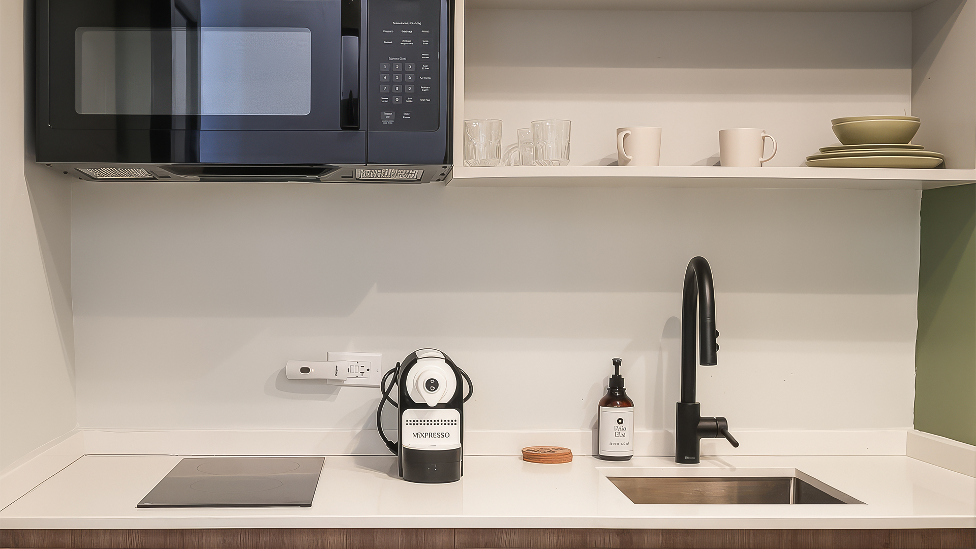 a kitchen with a microwave and a sink