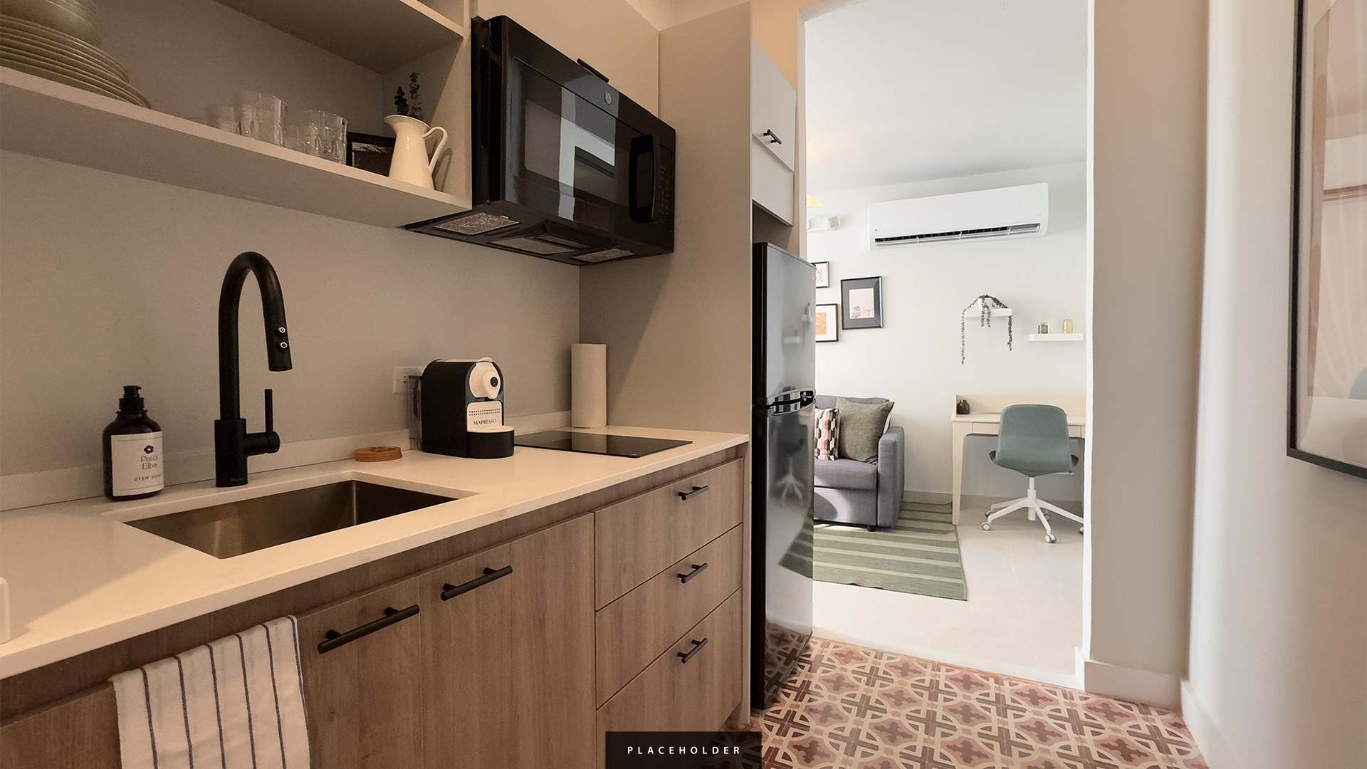 a kitchen with a microwave and a refrigerator