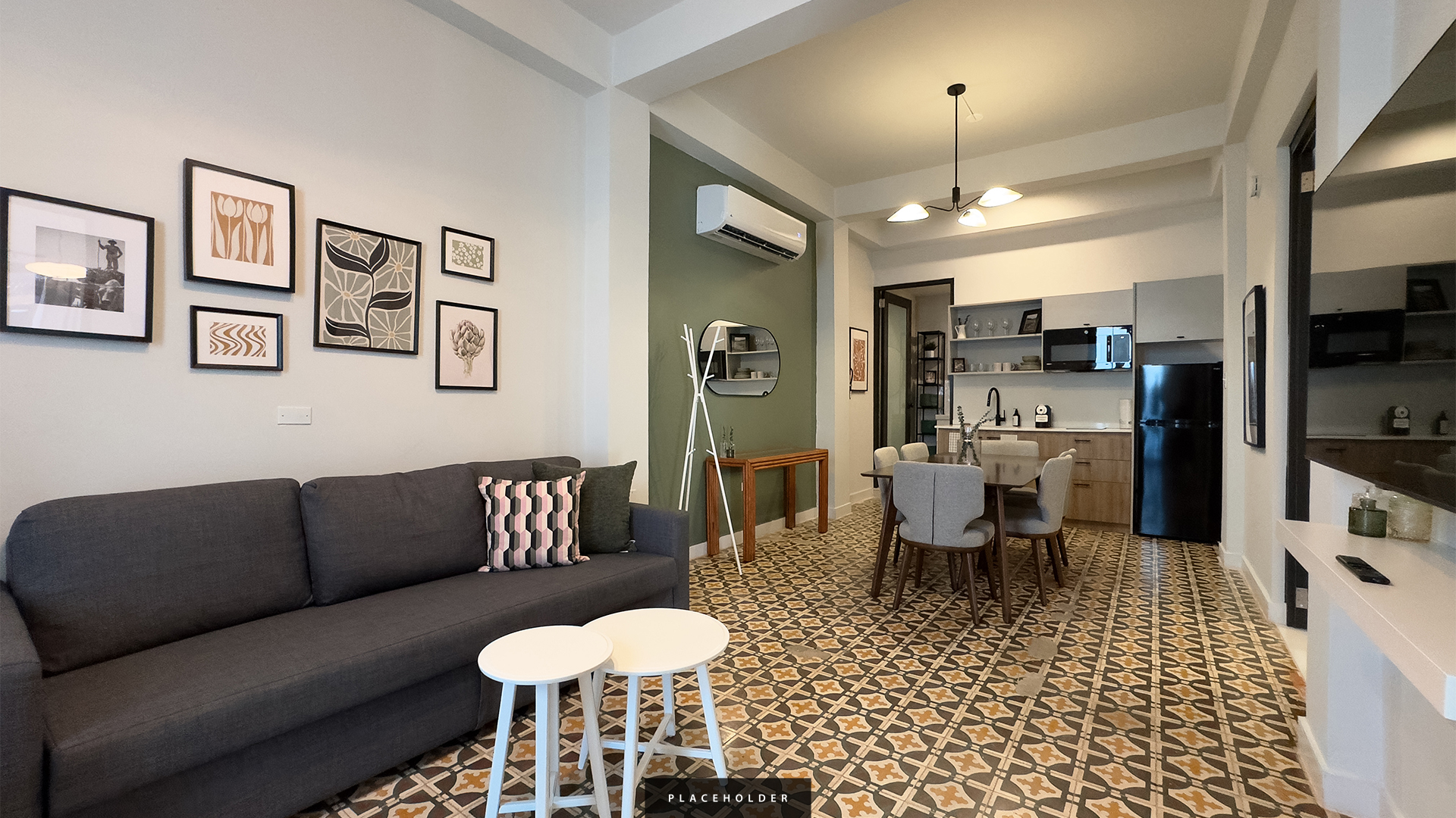 a living room with a couch and dining table