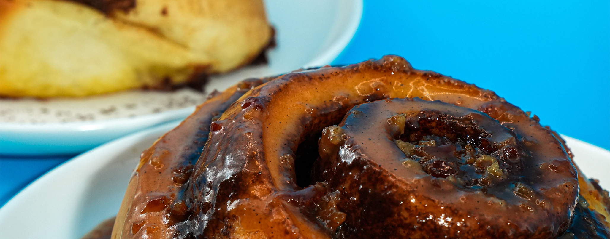 close up of a cinnamon bun on a plate