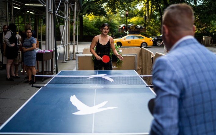 a woman playing ping pong