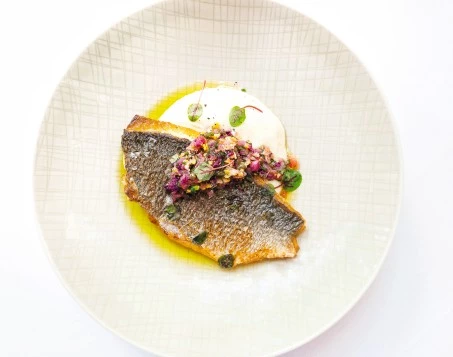 a plate of food on a white surface