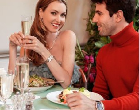 a man and woman sitting at a table