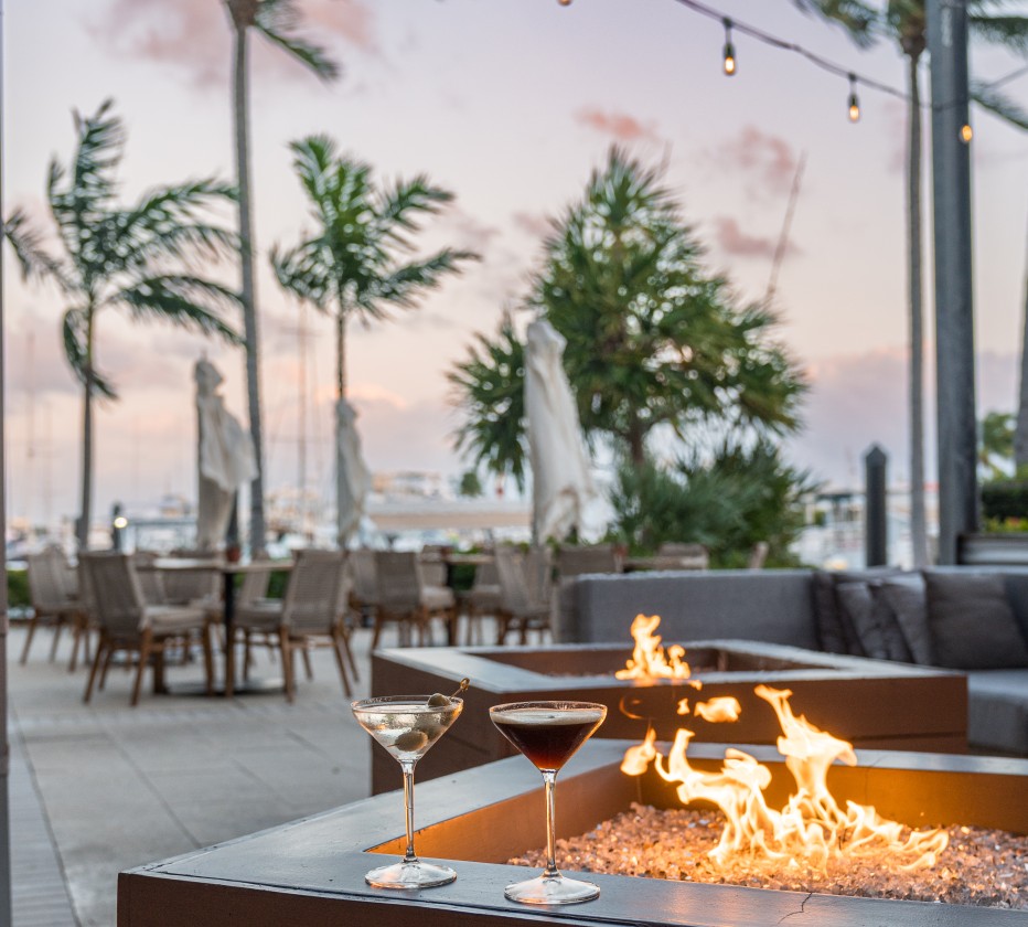 a fire pit with drinks on it