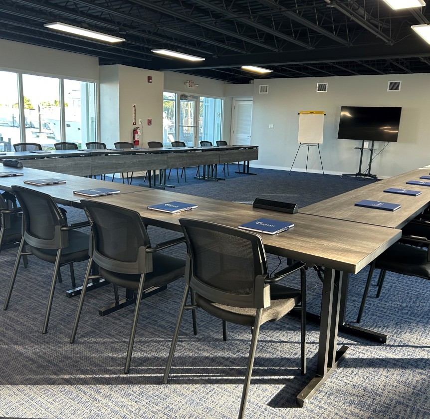 a room with a large table and chairs