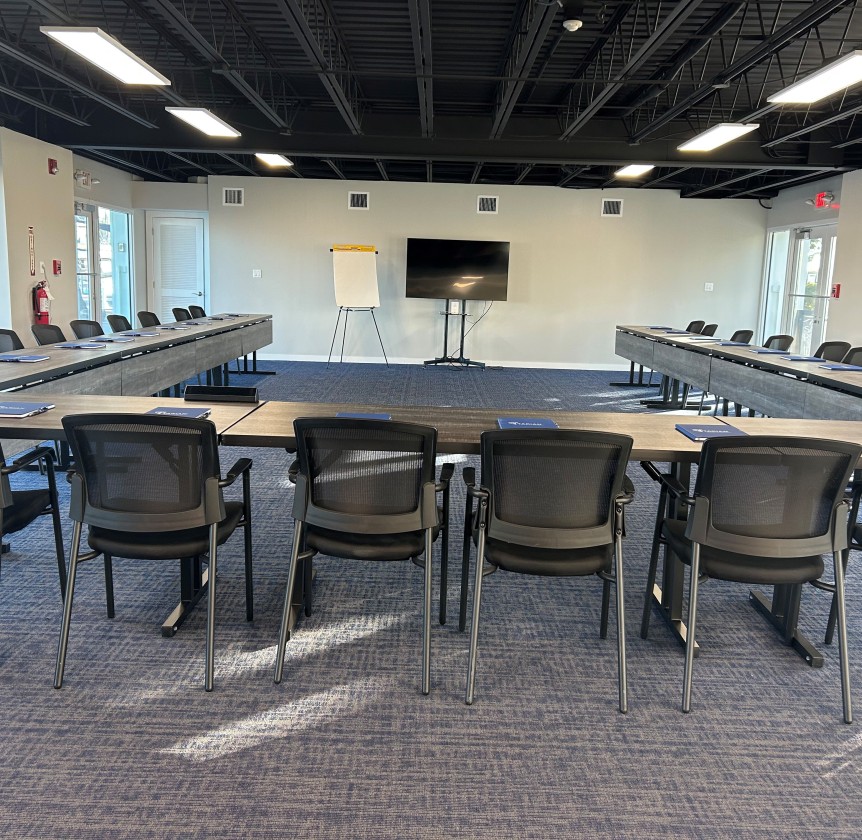 a room with a large table and chairs