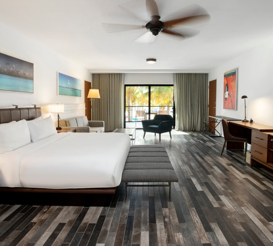 large suite with a king size bed and seating area