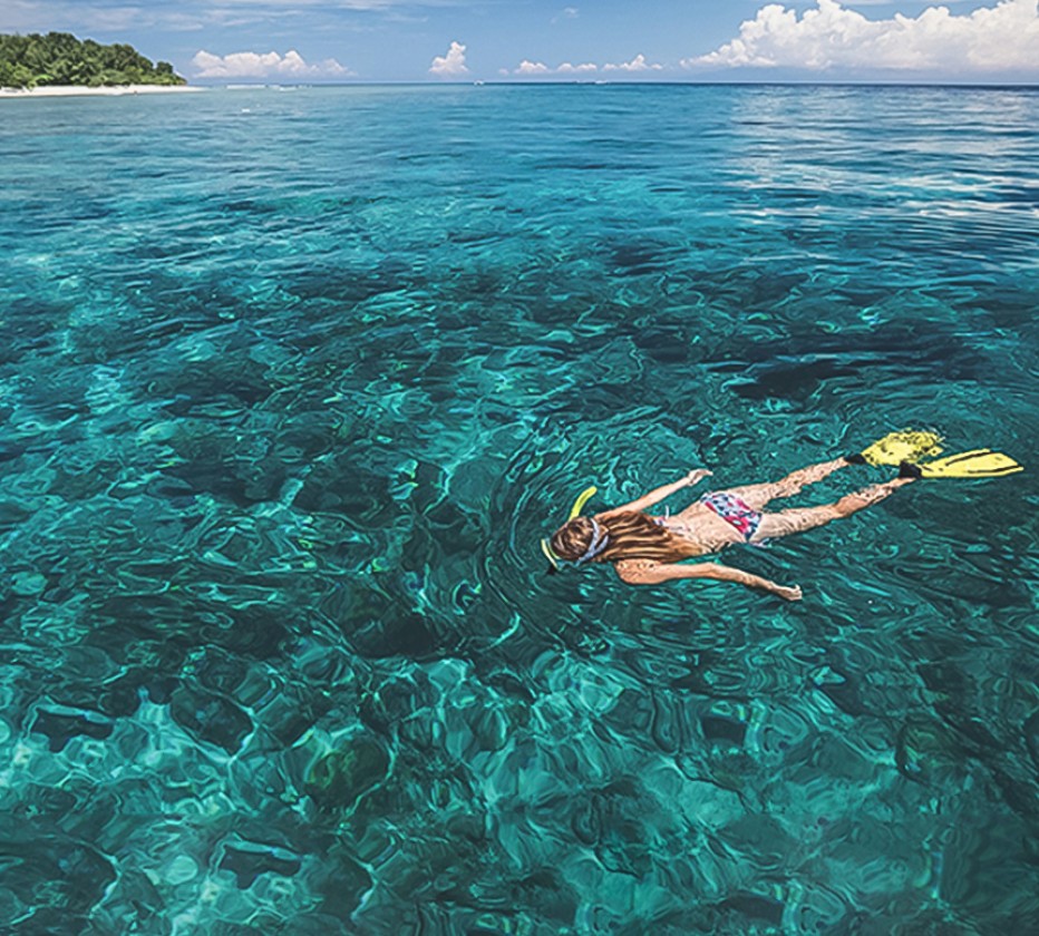 girl snorkeling in ocean