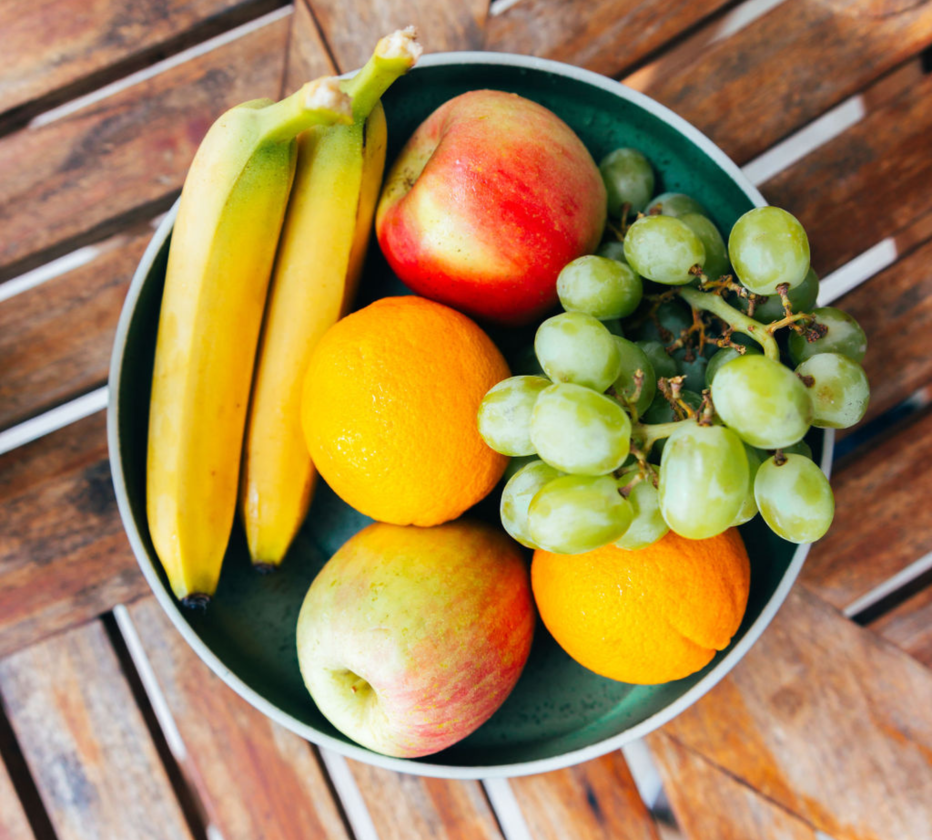 a bowl of fruit on a table