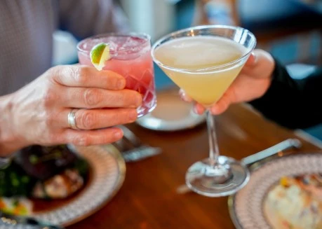 a person holding a drink