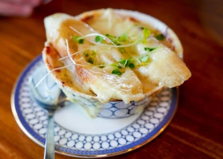 a bowl of soup with a spoon