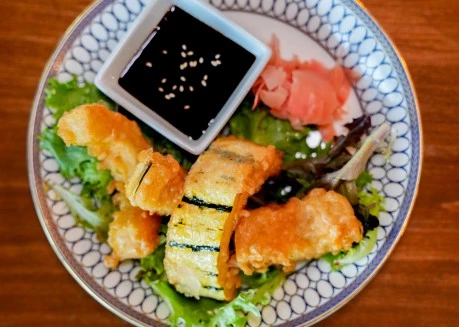 a plate of food with sauce