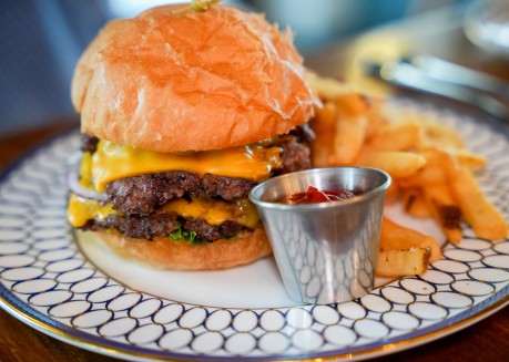a cheeseburger with fries on a plate