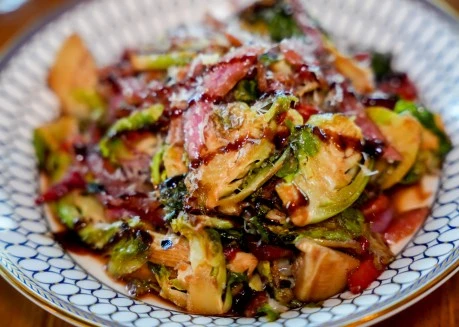 a bowl of food with a white and blue pattern