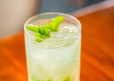 a glass of ice and mint drink