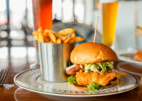 a burger and fries on a plate