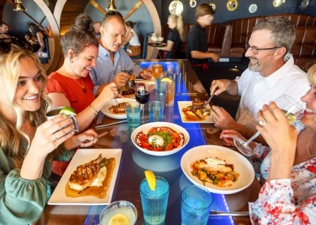 a group of people eating at a table