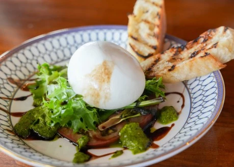 a plate of food with a white ball on top of it
