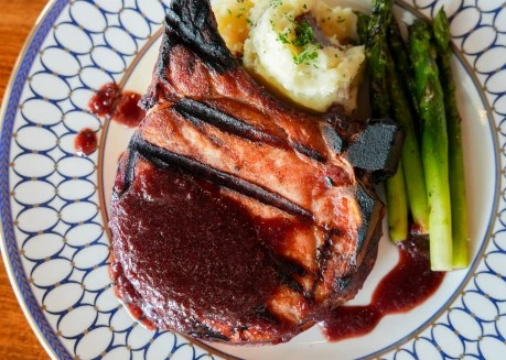 a plate of food with a sauce on it
