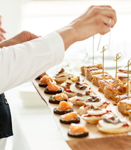 a person holding a plate of food
