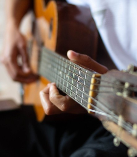 a person playing a guitar