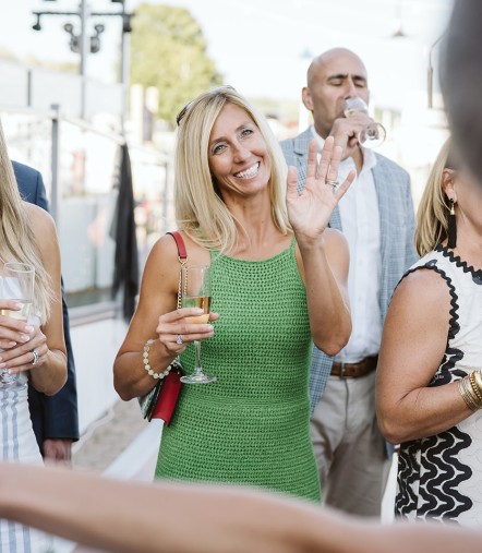 a group of people holding drinks