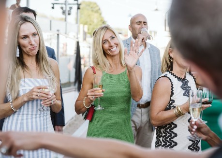 a group of people holding drinks