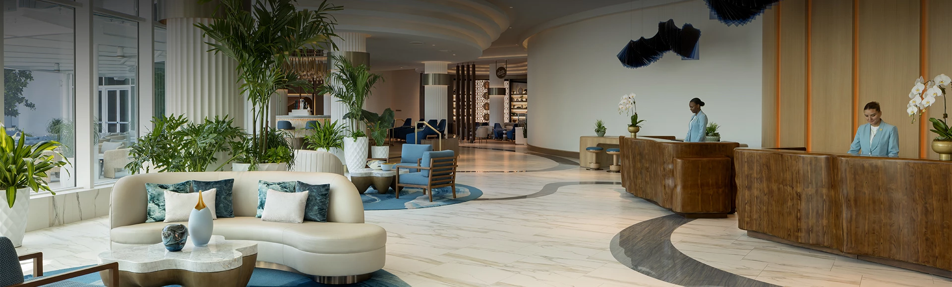 a lobby with chairs and tables
