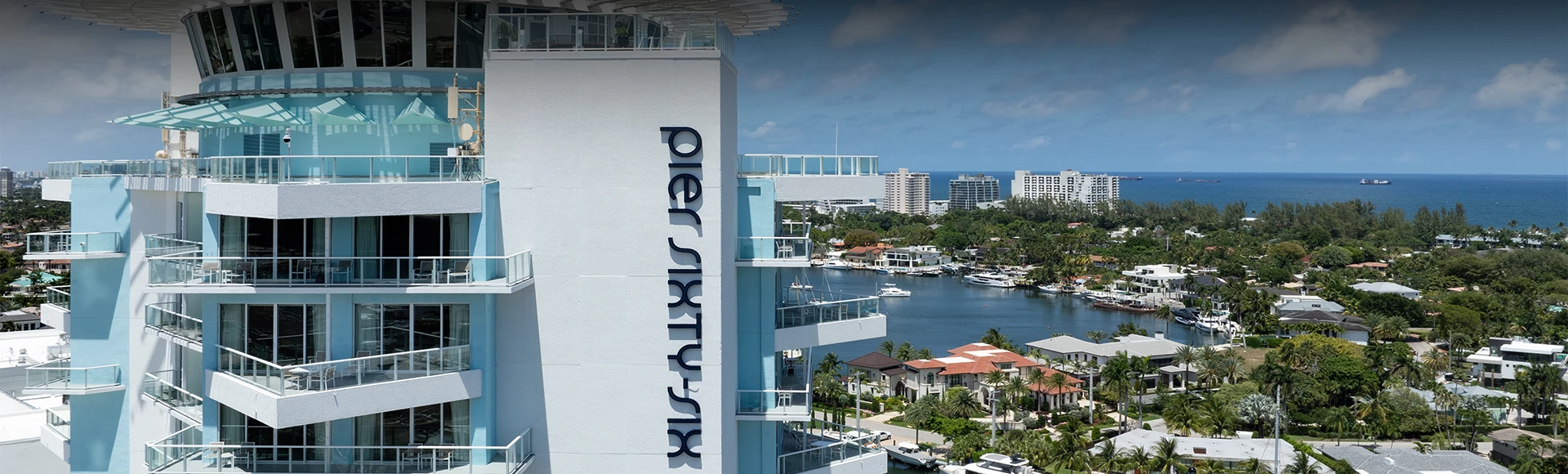 a building with a body of water and boats