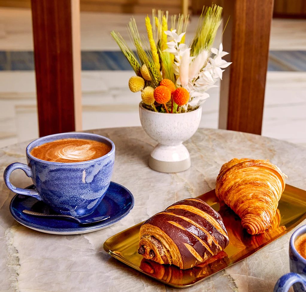 a coffee and pastries on a table