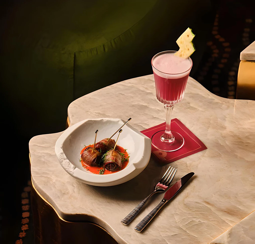 a plate of food and a drink on a table
