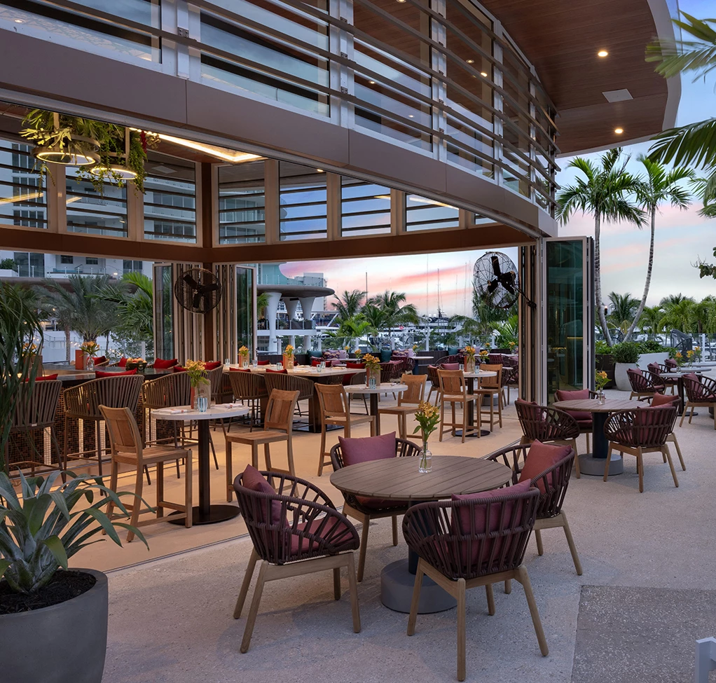 a patio with tables and chairs