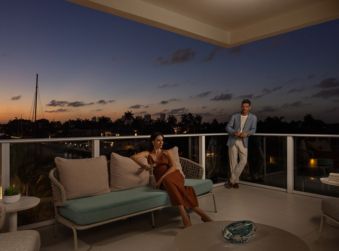 a man and woman on a balcony