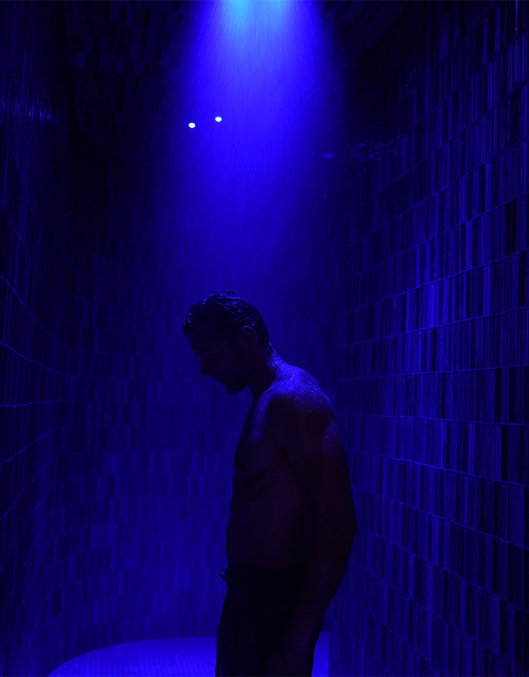 a man standing in a shower