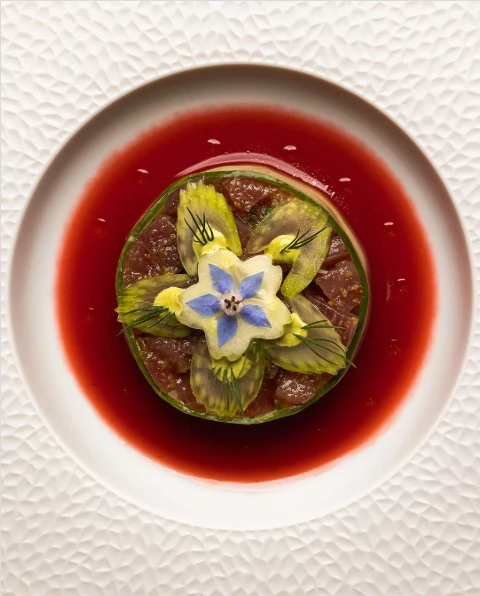 a plate of food with a flower on it