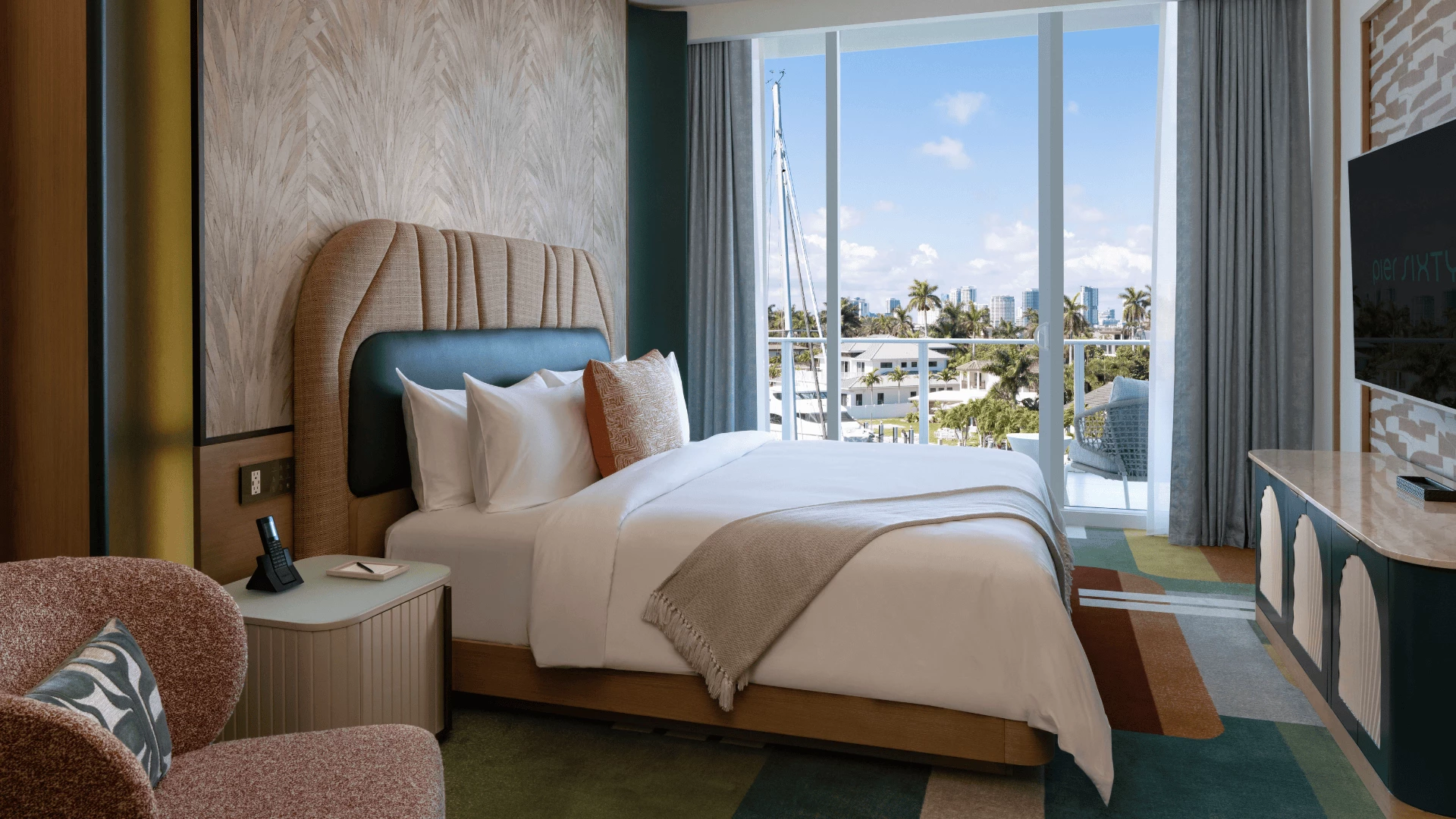 a bed with a view of the city from the window