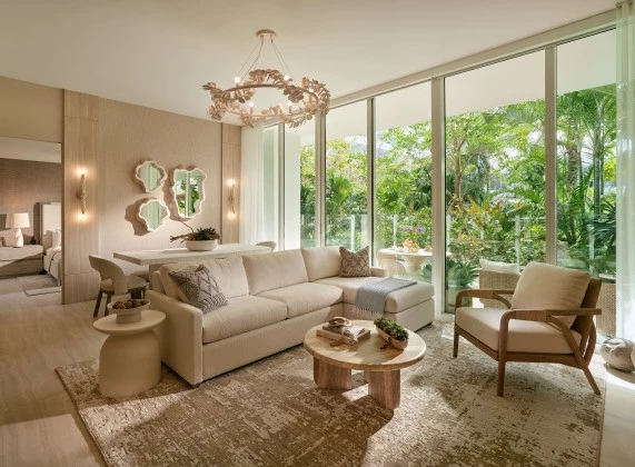 a living room with a couch and chairs