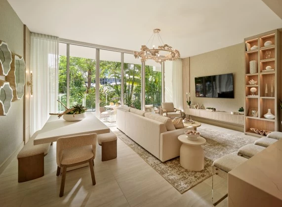 a living room with a large television and a table