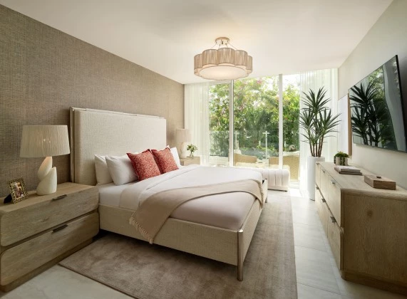 a bedroom with a large bed and a dresser