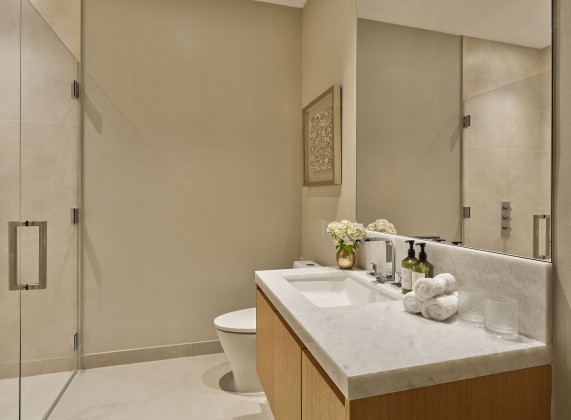 a bathroom with a large mirror and sink
