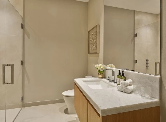 a bathroom with a large mirror and sink