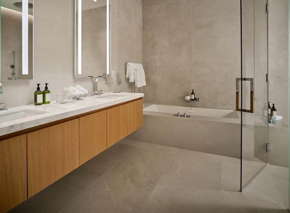 a bathroom with a glass shower door