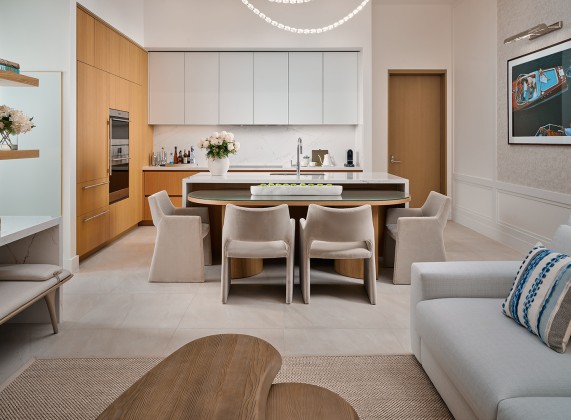 a kitchen and dining room with a table and chairs