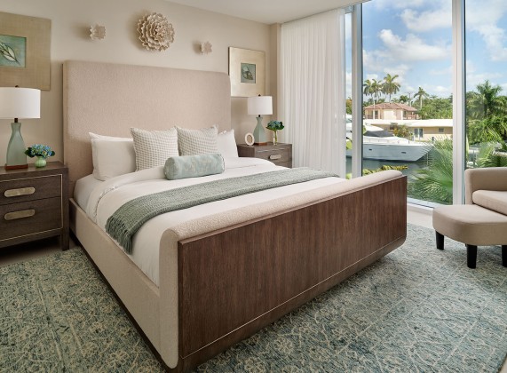 a bedroom with a bed and a glass door