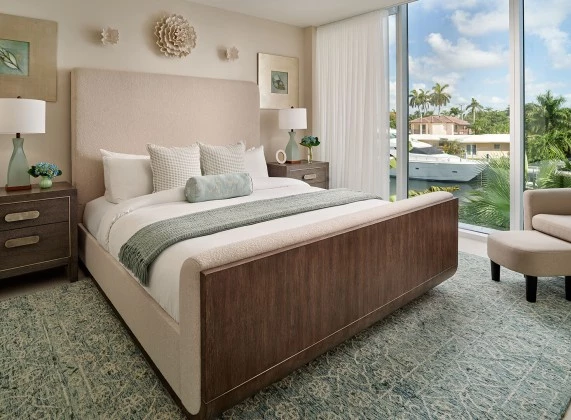 a bedroom with a bed and a glass door